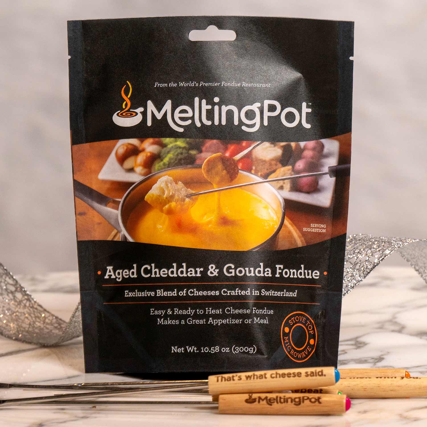 Package of Aged Cheddar & Gouda Cheese Fondue on Table