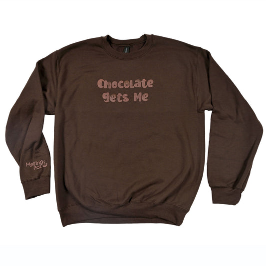 Chocolate Gets Me Sweatshirt on Table
